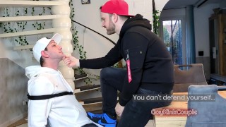 Bound on a chair at his mercy